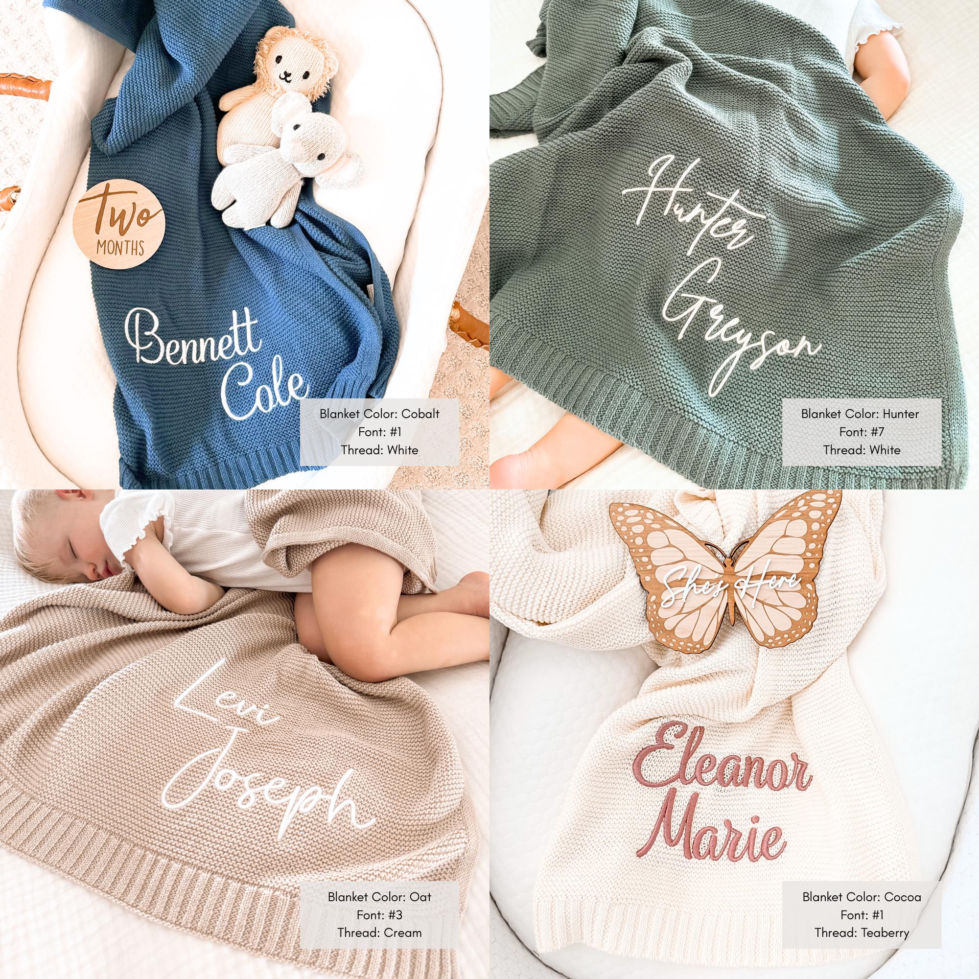 a baby sleeping on a blanket next to other items